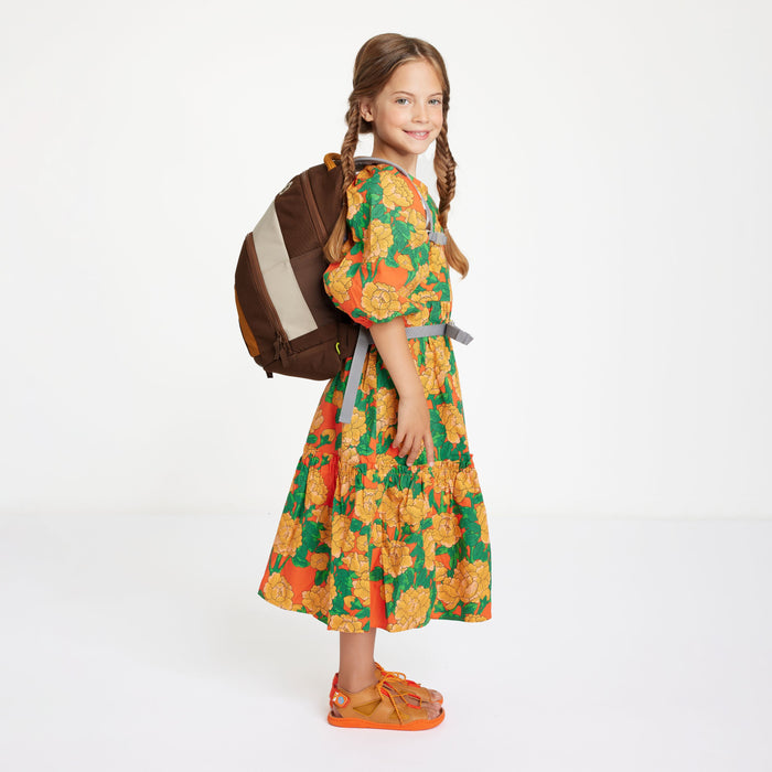 Child wearing the Affenzahn Daydreamer Monkey Backpack in brown colors, showing ergonomic straps and spacious design for school or travel.