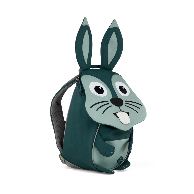 Left side view highlighting the Affenzahn Small Friend Rabbit backpack`s depth, adjustable shoulder straps, and the Rabbit's ear detailing.