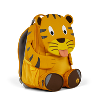 Left side view highlighting the Affenzahn Large Friend Tiger backpack`s depth, adjustable shoulder straps, and the Tiger's ear detailing.