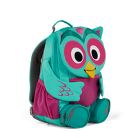Left side view highlighting the Affenzahn Large Friend Owl backpack`s depth, adjustable shoulder straps, and the Owl's ear detailing.