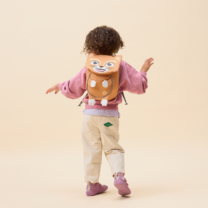 Affenzahn Small Friend Cat backpack worn by a toddler, illustrating its size and fit.