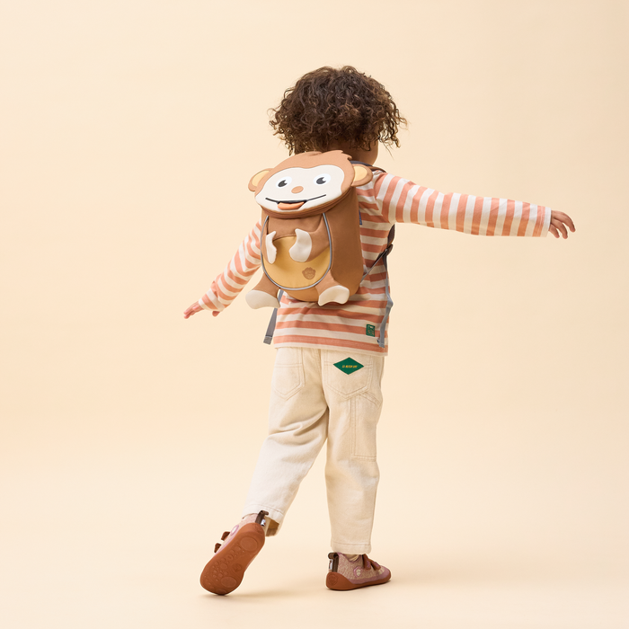 Affenzahn Small Friend Monkey backpack worn by a toddler, illustrating its size and fit.