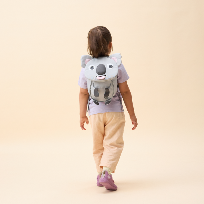 Affenzahn Small Friend Koala backpack worn by a toddler, illustrating its size and fit.