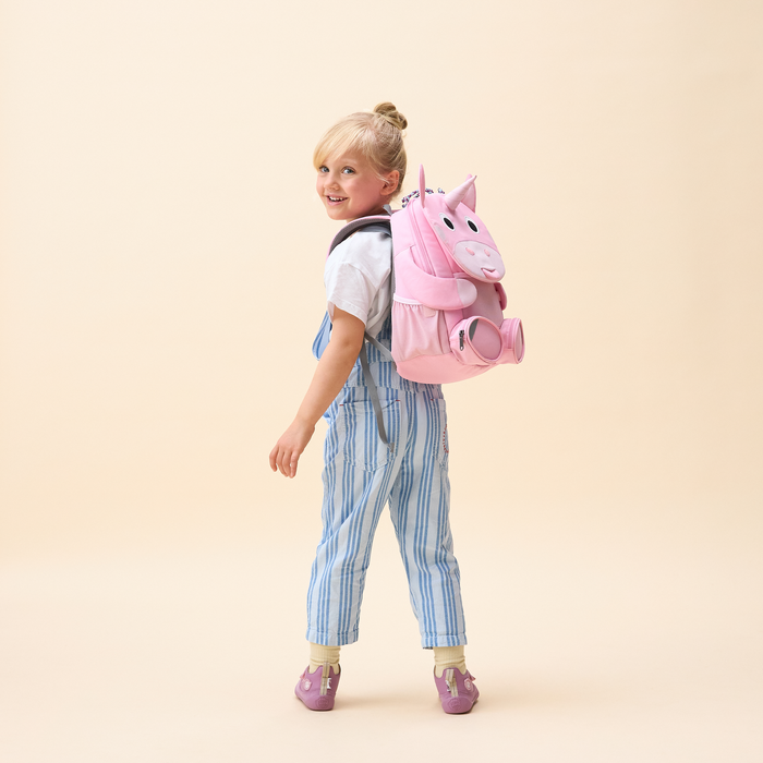 Affenzahn Large Friend Unicorn backpack worn by a child, illustrating its size and fit.