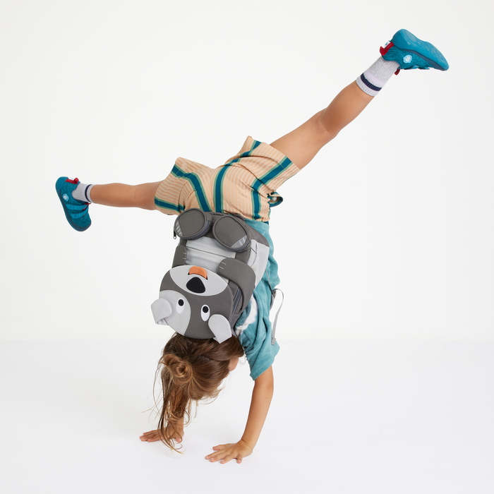 Affenzahn Large Friend Dog backpack worn by a child, illustrating its size and fit.